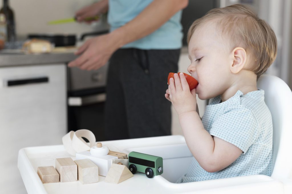 close-up-toddler-eating-tomato